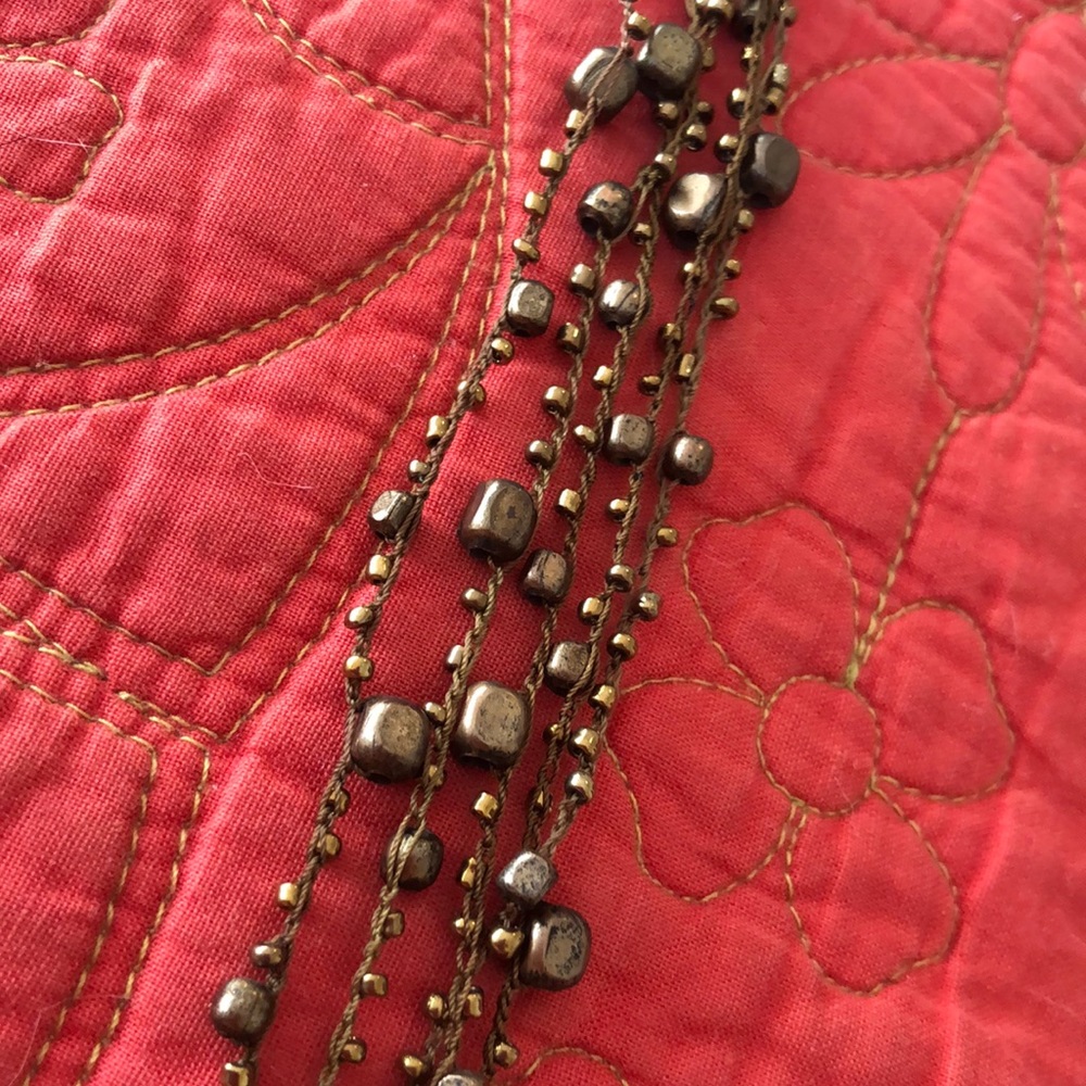 Striking 5 strand beaded necklace .